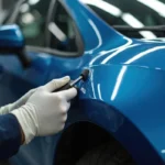 Auto repair technician using tools in a flexible gig economy role within the skilled trades industry